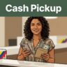 An Ecuadorian woman smiling with cash and a smartphone at a pickup counter.