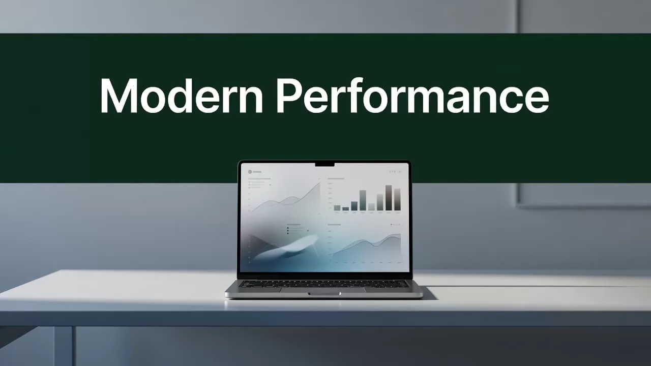 An open laptop rests on a clean desk beneath a bold green sign reading Modern Performance.