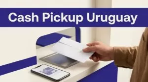 Hand receiving a cash envelope at a Uruguay remittance counter.