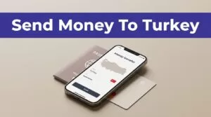 A smartphone showing a Turkey transfer app sits beside a passport and bank card.