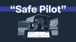 An autonomous-ready haul truck parked in a quarry beside a tablet dashboard.