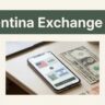 A smartphone showing currency conversion beside U.S. dollars and Argentine pesos.