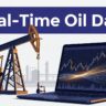 An oil pumpjack beside a laptop displaying live price charts.