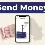 Smartphone showing a money transfer beside a Serbian dinar note and map.