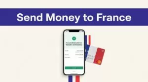 A smartphone confirms a money transfer beside a French bank card.