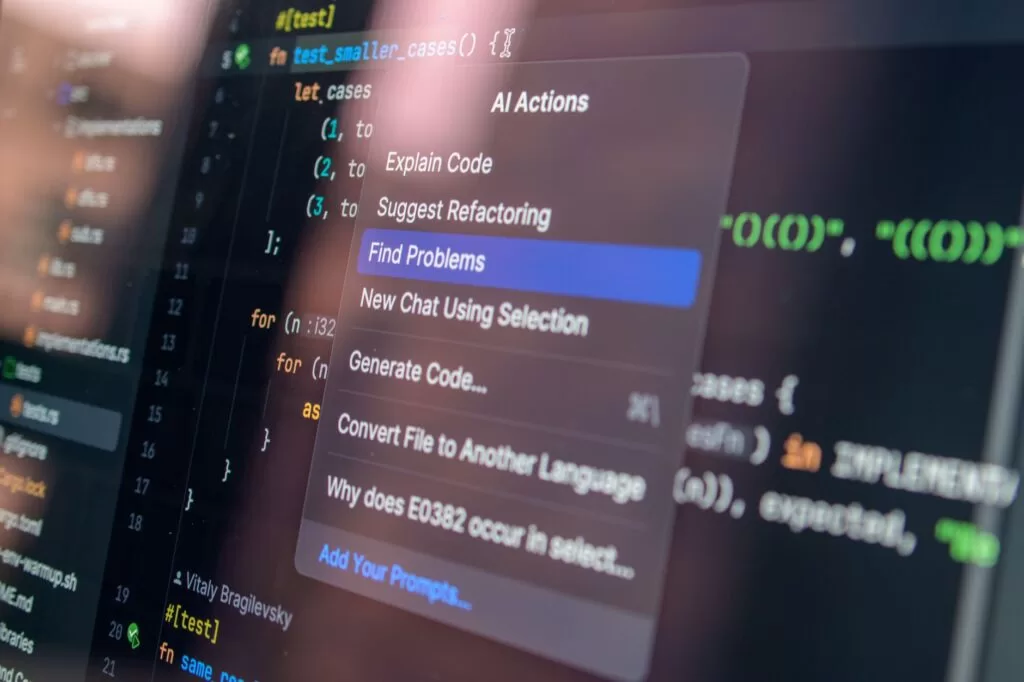 A modern monitor showing a software analytics dashboard with developer testing metrics.