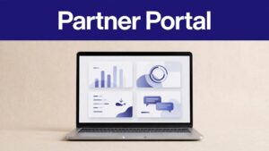 Laptop displaying a partner dashboard with referral and earnings cards.