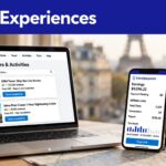 Laptop and smartphone showing travel booking and affiliate screens near a European landmark.